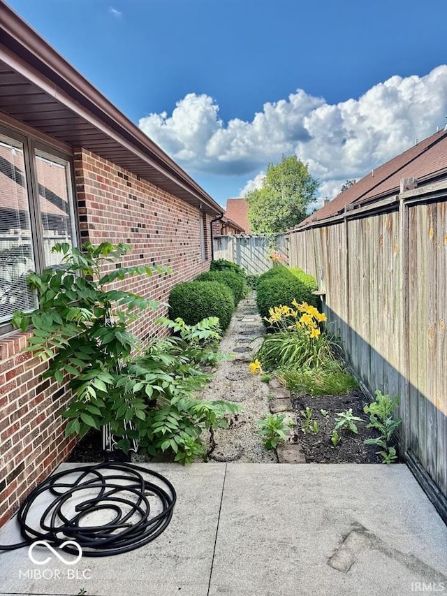 3400 W Riggin Rd, Muncie, IN 47304 - fenced backyard with a patio