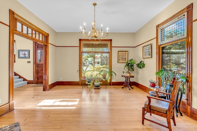 408 E Wabash Ave, Crawfordsville, IN 47933 - sitting room featuring a chandelier, stairway, and hardwood / wood-style flooring