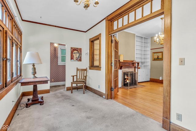 408 E Wabash Ave, Crawfordsville, IN 47933 - hallway featuring a chandelier, carpet flooring, ornamental molding, plenty of natural light, and built in shelves