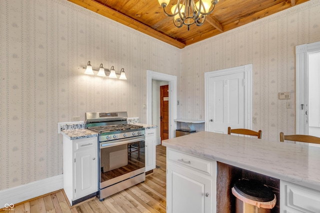 408 E Wabash Ave, Crawfordsville, IN 47933 - kitchen with stainless steel range with gas cooktop, light wood-style flooring, a wooden ceiling with exposed beams, a chandelier, and white cabinets