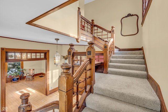 408 E Wabash Ave, Crawfordsville, IN 47933 - staircase with hardwood / wood-style floors and baseboards