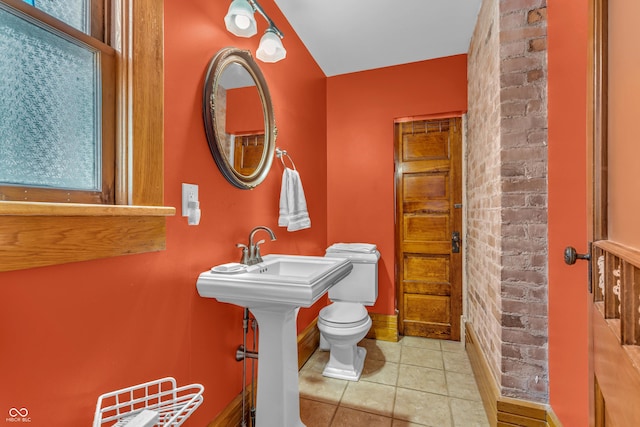 408 E Wabash Ave, Crawfordsville, IN 47933 - bathroom with tile patterned flooring and brick wall