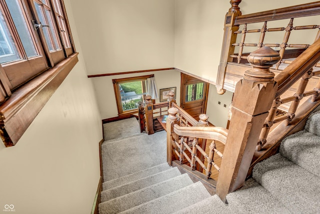 408 E Wabash Ave, Crawfordsville, IN 47933 - staircase featuring a high ceiling and carpet