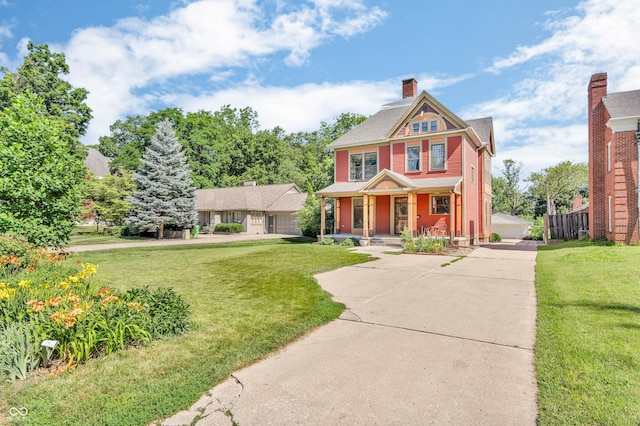 408 E Wabash Ave, Crawfordsville, IN 47933 - victorian house featuring covered porch and a chimney
