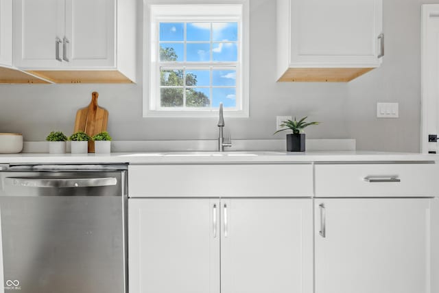 2012 N Dexter St, Indianapolis, IN 46202 - kitchen featuring stainless steel dishwasher, white cabinets, and light countertops