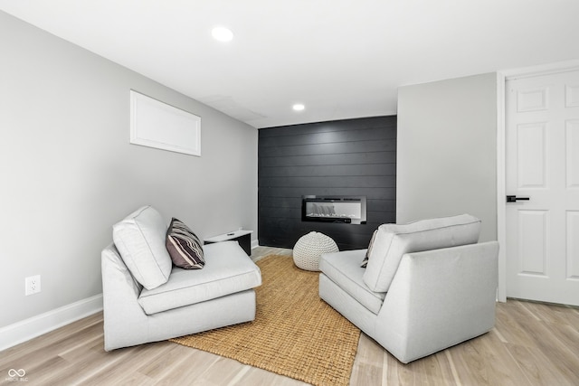 2012 N Dexter St, Indianapolis, IN 46202 - living room with light wood-style floors, a large fireplace, recessed lighting, and heating unit