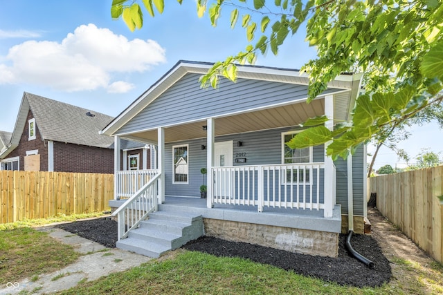 2012 N Dexter St, Indianapolis, IN 46202 - view of front of house featuring covered porch and a fenced backyard