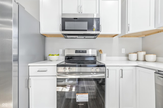 2012 N Dexter St, Indianapolis, IN 46202 - kitchen featuring stainless steel appliances, white cabinetry, light countertops, and wood finished floors