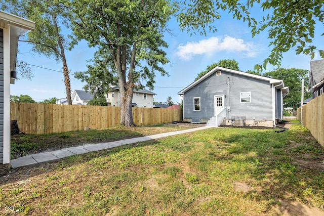2012 N Dexter St, Indianapolis, IN 46202 - rear view of house with entry steps and a fenced backyard