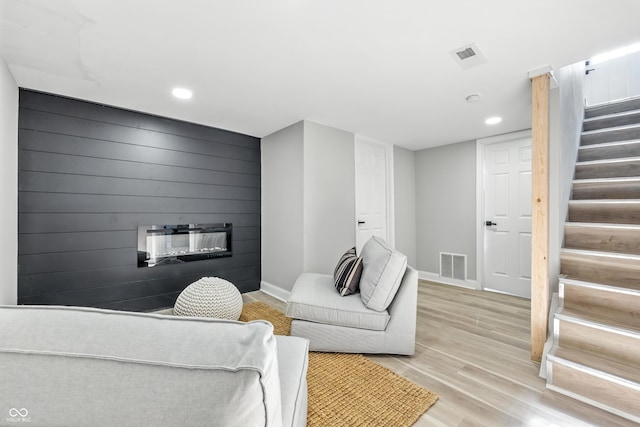 2012 N Dexter St, Indianapolis, IN 46202 - living room with stairs, recessed lighting, light wood-style floors, and a large fireplace