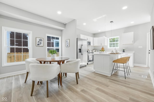 2012 N Dexter St, Indianapolis, IN 46202 - dining area with light wood-style floors and recessed lighting