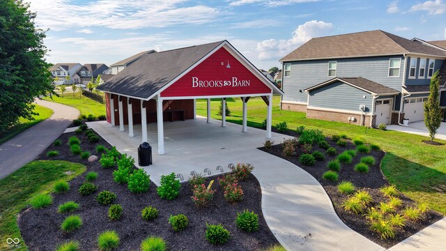 11480 Plough St, Noblesville, IN 46060 - view of property's community featuring a yard, driveway, and a carport