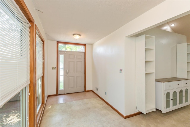 221 N Adams St, Brownsburg, IN 46112 - entrance foyer with light colored carpet and baseboards