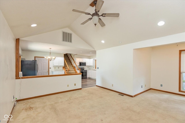 221 N Adams St, Brownsburg, IN 46112 - unfurnished living room with light colored carpet, ceiling fan, recessed lighting, a chandelier, and stairway