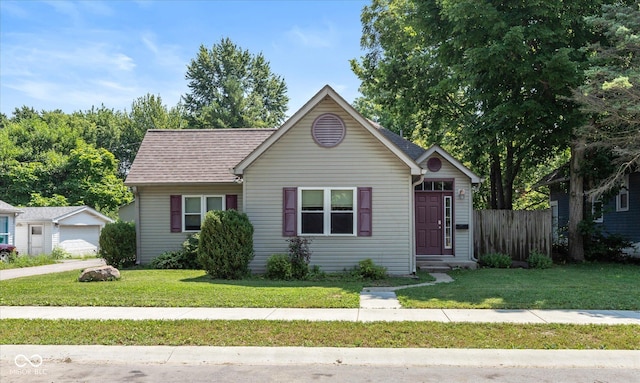 221 N Adams St, Brownsburg, IN 46112 - view of front facade with an outdoor structure and roof with shingles