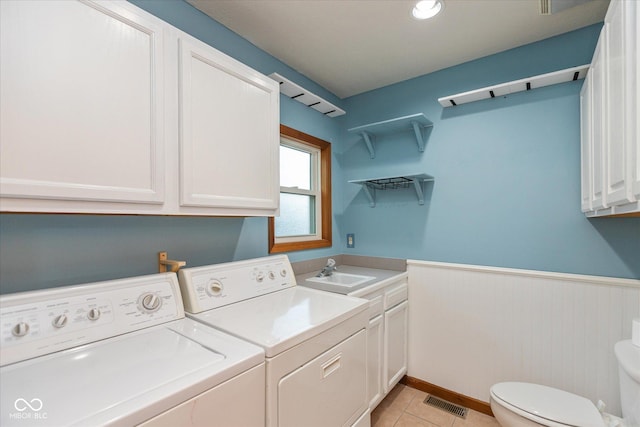 221 N Adams St, Brownsburg, IN 46112 - laundry room featuring washing machine and clothes dryer, wainscoting, and light tile patterned flooring