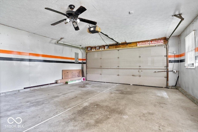 3628 Paddington Cir, Indianapolis, IN 46268 - garage featuring a garage door opener, ceiling fan, and electric panel