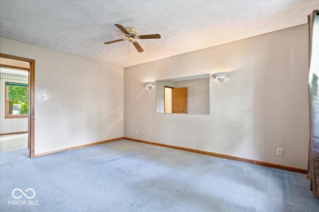 3628 Paddington Cir, Indianapolis, IN 46268 - spare room featuring carpet, a ceiling fan, and a textured ceiling