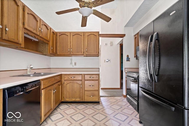3628 Paddington Cir, Indianapolis, IN 46268 - kitchen featuring black appliances, light countertops, brown cabinets, ceiling fan, and light flooring