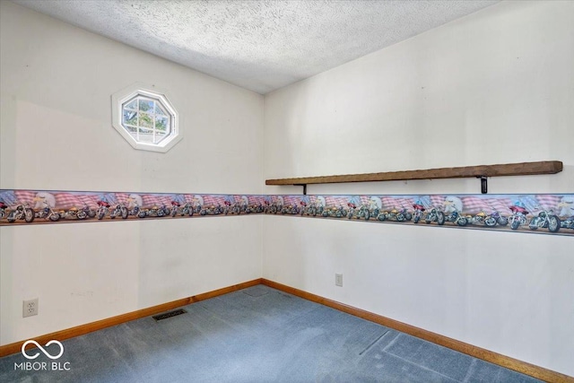 3628 Paddington Cir, Indianapolis, IN 46268 - empty room with carpet and a textured ceiling
