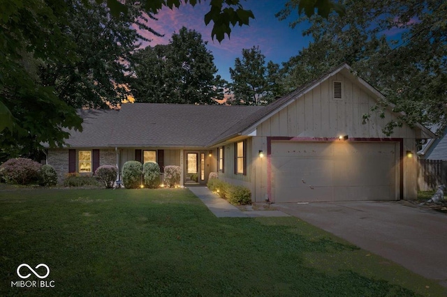 3628 Paddington Cir, Indianapolis, IN 46268 - single story home featuring an attached garage, board and batten siding, a front lawn, driveway, and roof with shingles