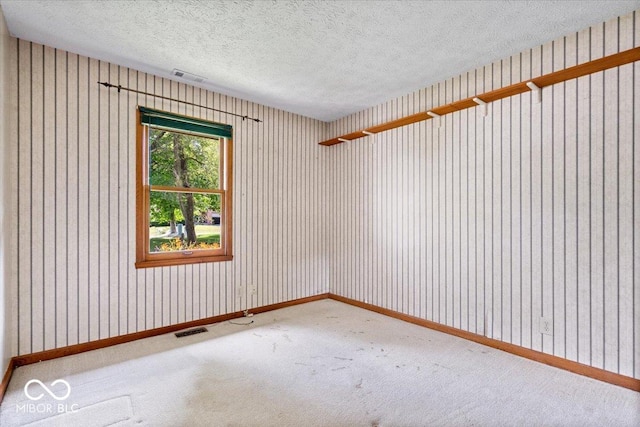 3628 Paddington Cir, Indianapolis, IN 46268 - carpeted empty room featuring baseboards and a textured ceiling