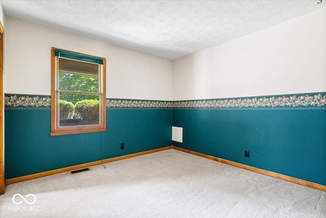 3628 Paddington Cir, Indianapolis, IN 46268 - empty room with carpet floors and a textured ceiling