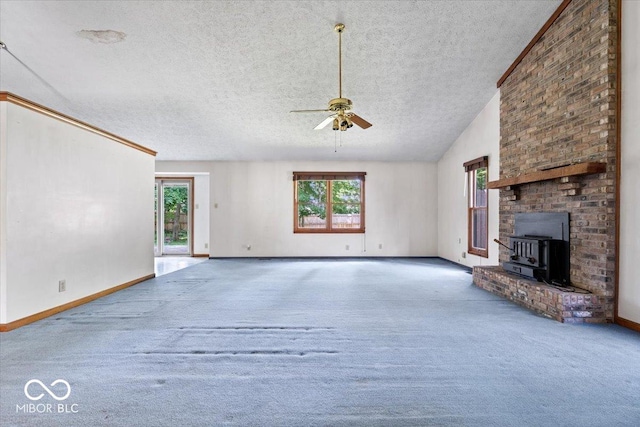 3628 Paddington Cir, Indianapolis, IN 46268 - unfurnished living room with a textured ceiling, carpet floors, a ceiling fan, vaulted ceiling, and a wood stove