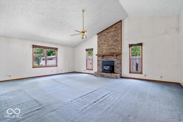 3628 Paddington Cir, Indianapolis, IN 46268 - unfurnished living room with ceiling fan, a textured ceiling, healthy amount of natural light, carpet flooring, and high vaulted ceiling