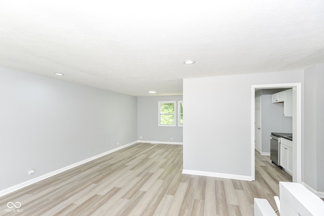 2521 Winfield Ave, Indianapolis, IN 46222 - spare room featuring light wood finished floors, recessed lighting, and a textured ceiling