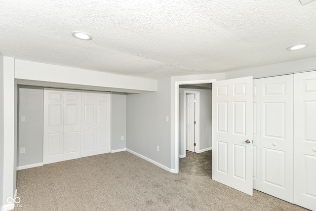 2521 Winfield Ave, Indianapolis, IN 46222 - unfurnished bedroom featuring light colored carpet, a textured ceiling, and recessed lighting