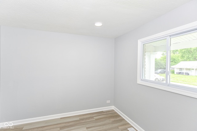 2521 Winfield Ave, Indianapolis, IN 46222 - empty room featuring light wood finished floors and recessed lighting