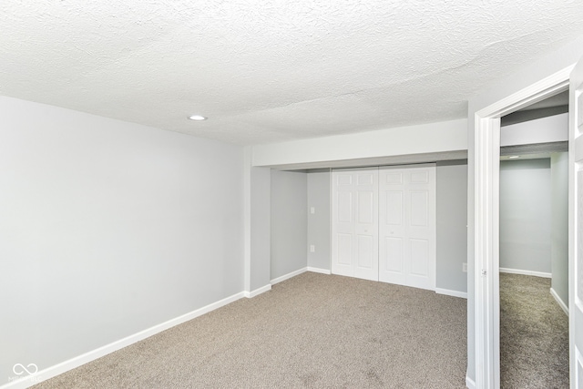 2521 Winfield Ave, Indianapolis, IN 46222 - unfurnished bedroom featuring carpet, a closet, a textured ceiling, and recessed lighting
