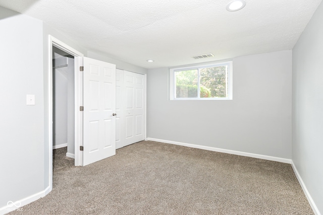 2521 Winfield Ave, Indianapolis, IN 46222 - unfurnished bedroom with carpet flooring, recessed lighting, and a textured ceiling