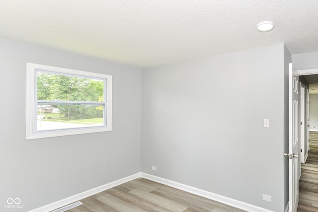 2521 Winfield Ave, Indianapolis, IN 46222 - spare room with wood finished floors and baseboards