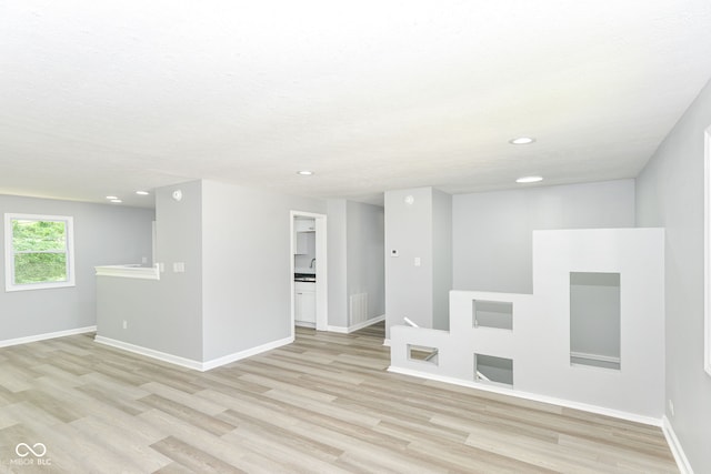 2521 Winfield Ave, Indianapolis, IN 46222 - empty room featuring light wood finished floors and recessed lighting