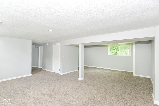 2521 Winfield Ave, Indianapolis, IN 46222 - basement with carpet flooring, a textured ceiling, and recessed lighting