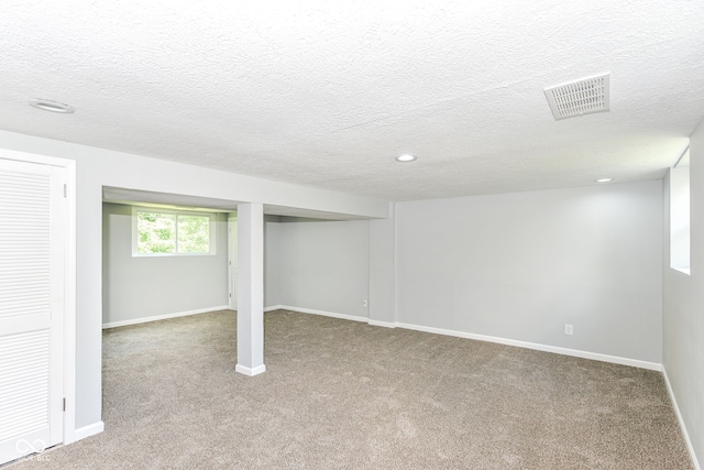 2521 Winfield Ave, Indianapolis, IN 46222 - basement featuring carpet flooring, recessed lighting, and a textured ceiling