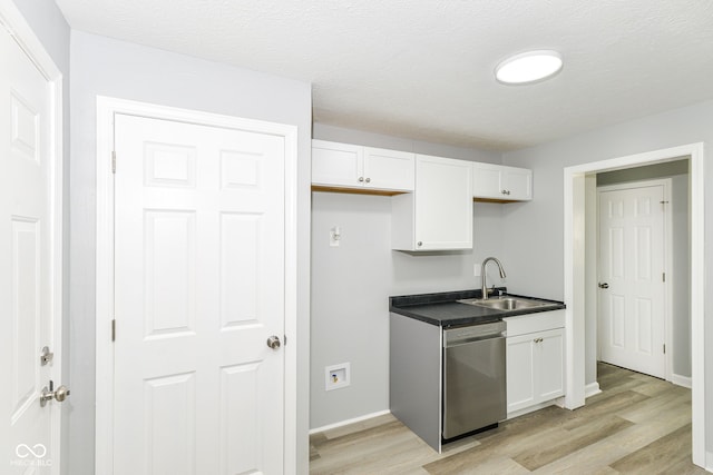 2521 Winfield Ave, Indianapolis, IN 46222 - kitchen featuring dishwasher, light wood-style flooring, white cabinets, and dark countertops