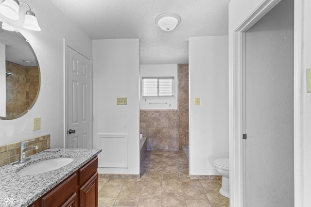 12443 Rose Haven Dr, Indianapolis, IN 46235 - full bath with vanity, a bath, a textured ceiling, and a shower