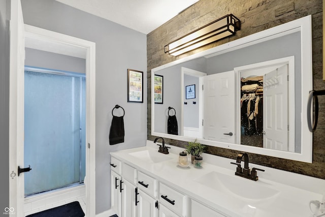 826 Royal Saint George Dr, Greenwood, IN 46143 - bathroom featuring a stall shower, double vanity, and a walk in closet