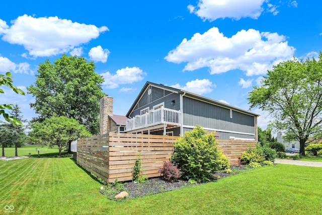 826 Royal Saint George Dr, Greenwood, IN 46143 - rear view of house with a lawn and a deck