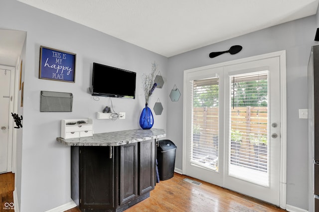 826 Royal Saint George Dr, Greenwood, IN 46143 - bar area featuring baseboards and light wood finished floors