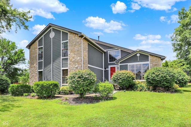 826 Royal Saint George Dr, Greenwood, IN 46143 - view of front of home featuring stone siding and a front lawn