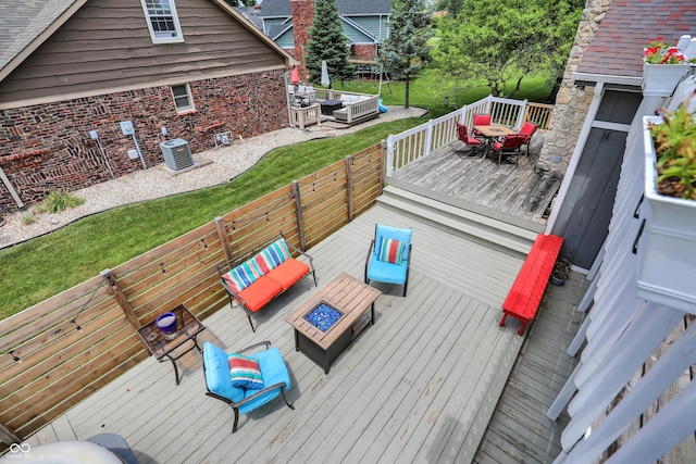 826 Royal Saint George Dr, Greenwood, IN 46143 - wooden terrace featuring an outdoor living space with a fire pit and outdoor dining space
