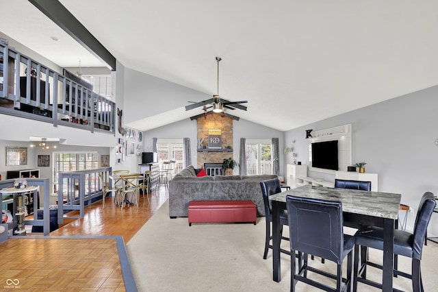 826 Royal Saint George Dr, Greenwood, IN 46143 - dining area featuring ceiling fan, healthy amount of natural light, a fireplace, and high vaulted ceiling