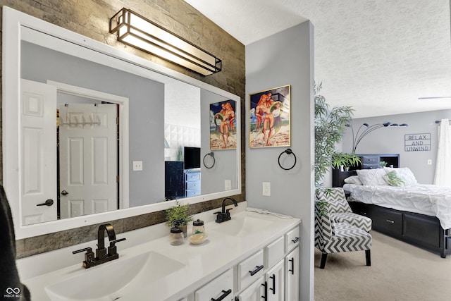 826 Royal Saint George Dr, Greenwood, IN 46143 - ensuite bathroom featuring double vanity and a textured ceiling