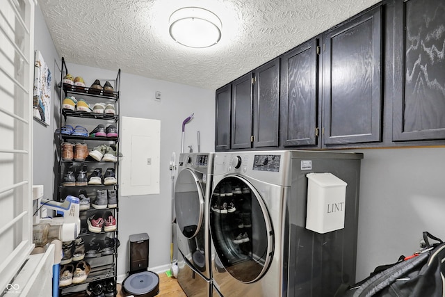 826 Royal Saint George Dr, Greenwood, IN 46143 - laundry room with washing machine and dryer, cabinet space, a textured ceiling, electric panel, and light wood finished floors
