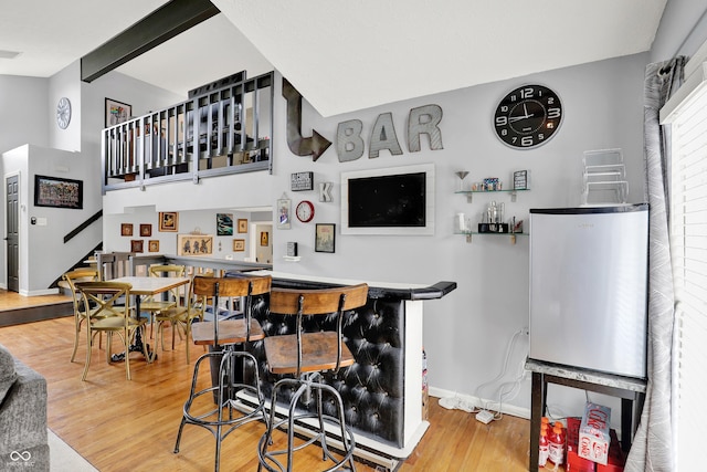826 Royal Saint George Dr, Greenwood, IN 46143 - indoor dry bar featuring wood finished floors and stairway