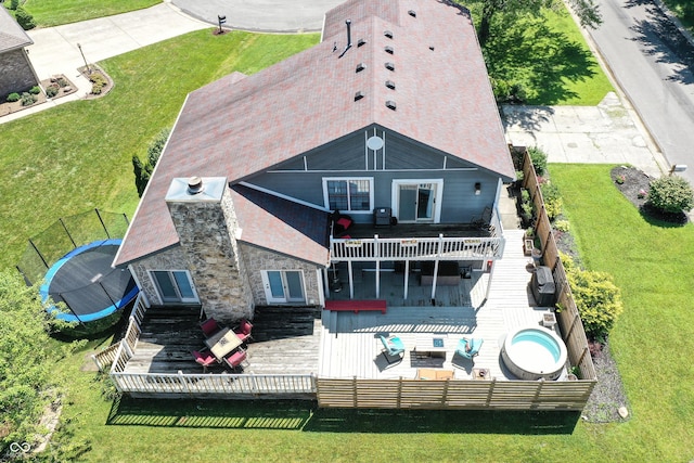 826 Royal Saint George Dr, Greenwood, IN 46143 - rear view of house featuring a wooden deck, an outdoor living space, and stone siding